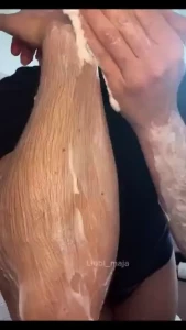 Spreading lots of white cream on my extremely hairy arms then