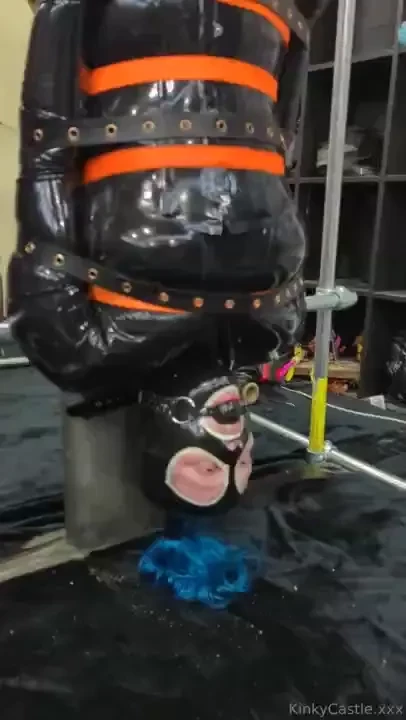 Lifting up a gagged rubberdoll into position part 2 of 9 
