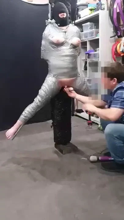 Held up in the air using only duct tape spread and exposed and 