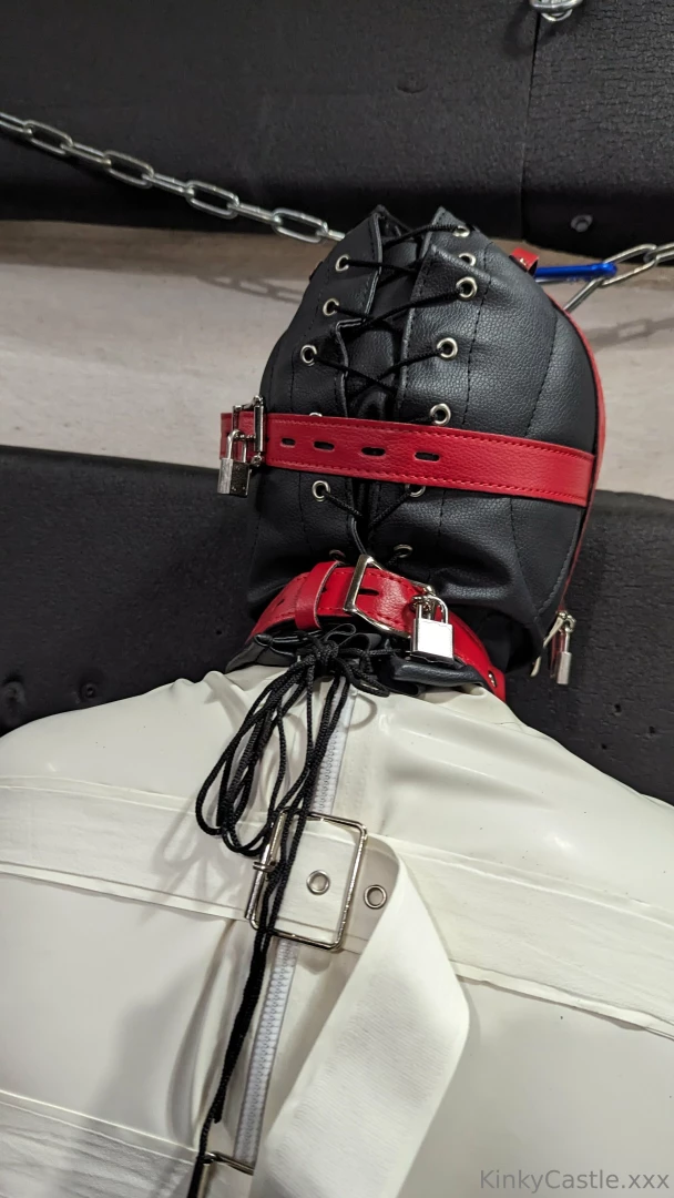 Padlocked hood latex straightjacket and legs held spread using tube part 2 
