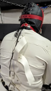Padlocked hood latex straightjacket and legs held spread using tube part 3