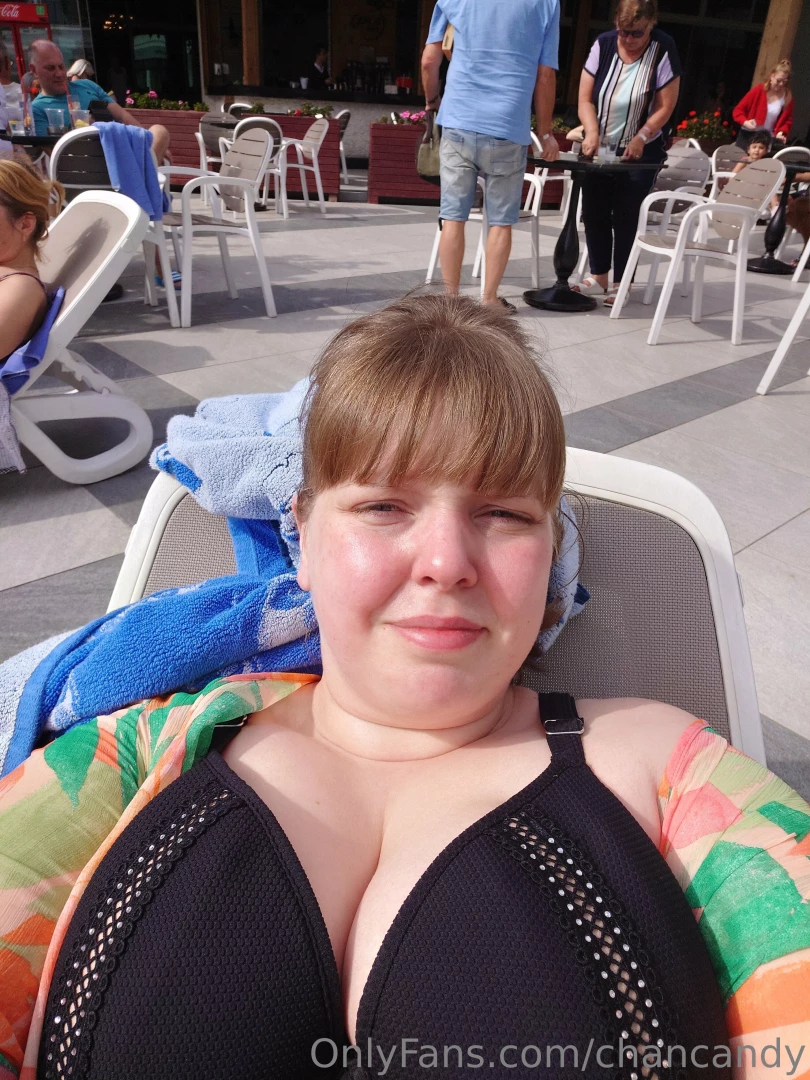 On hoilday sitting in the sun by the pool 