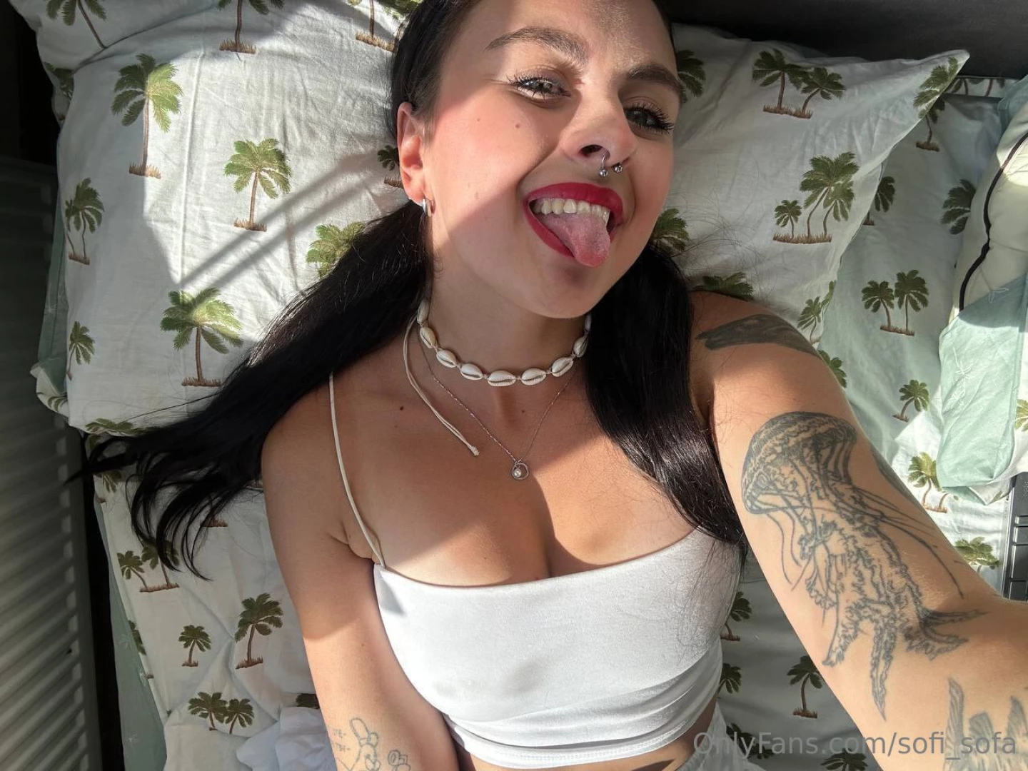 Here you are sitting in bed in a white top emitting positive vibes 