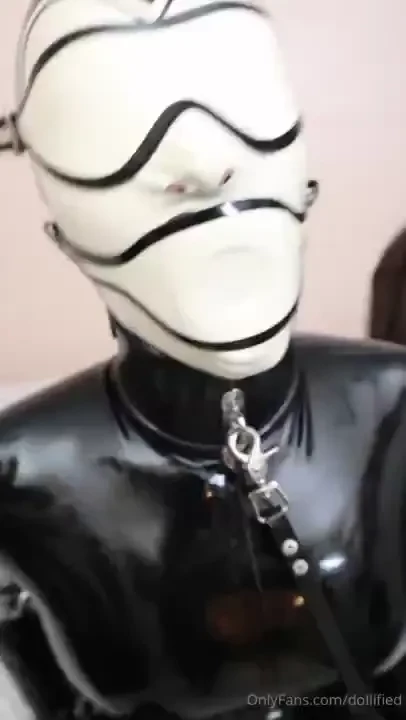 Rubberdoll raven enjoying her first total enclosure of latex 