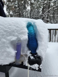New way to measure snow the purple clear one is 8 inches haha