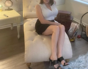 She was sitting on the beige chaise lounge when he entered the room he