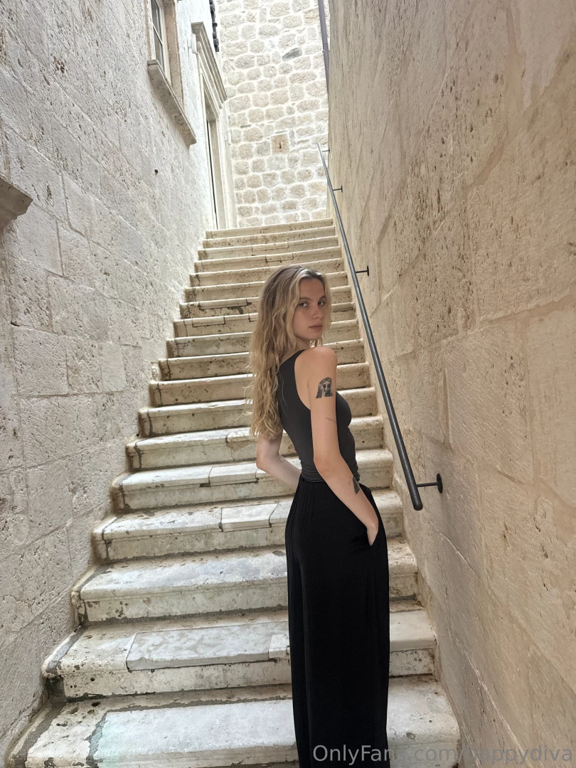 When a woman puts on a floor-length black dress she instantly 