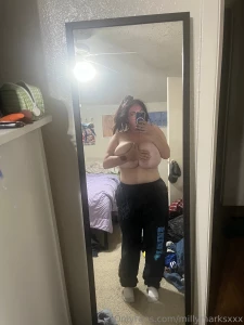 Hair tied sweat pants chillin w no make up on tittys out tho