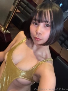 A tiny gold bikini that leaves out very interesting body areas to be