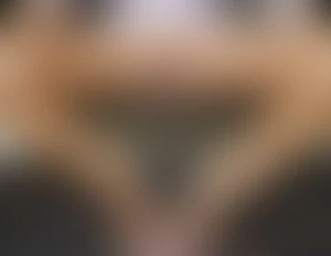 Seated on a bench with legs spreaded