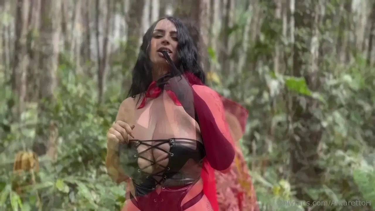 Little red riding hood is being spied on by the wolf and she starts to 