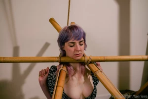 The blindfold has been lifted but new restraints are in place legs