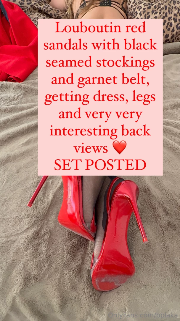 Louboutin red sandals with black seamed stockings and garnet belt 