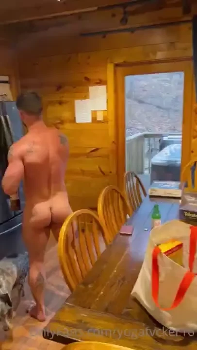 Clearing off the table in the nude getting ready for game night 