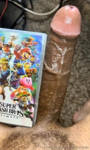 My dick next to a nintendo switch game case and a shroom bar box super part 1