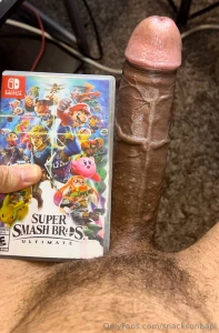 My dick next to a nintendo switch game case and a shroom bar box super part 2