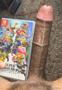 My dick next to a nintendo switch game case and a shroom bar box super part 5