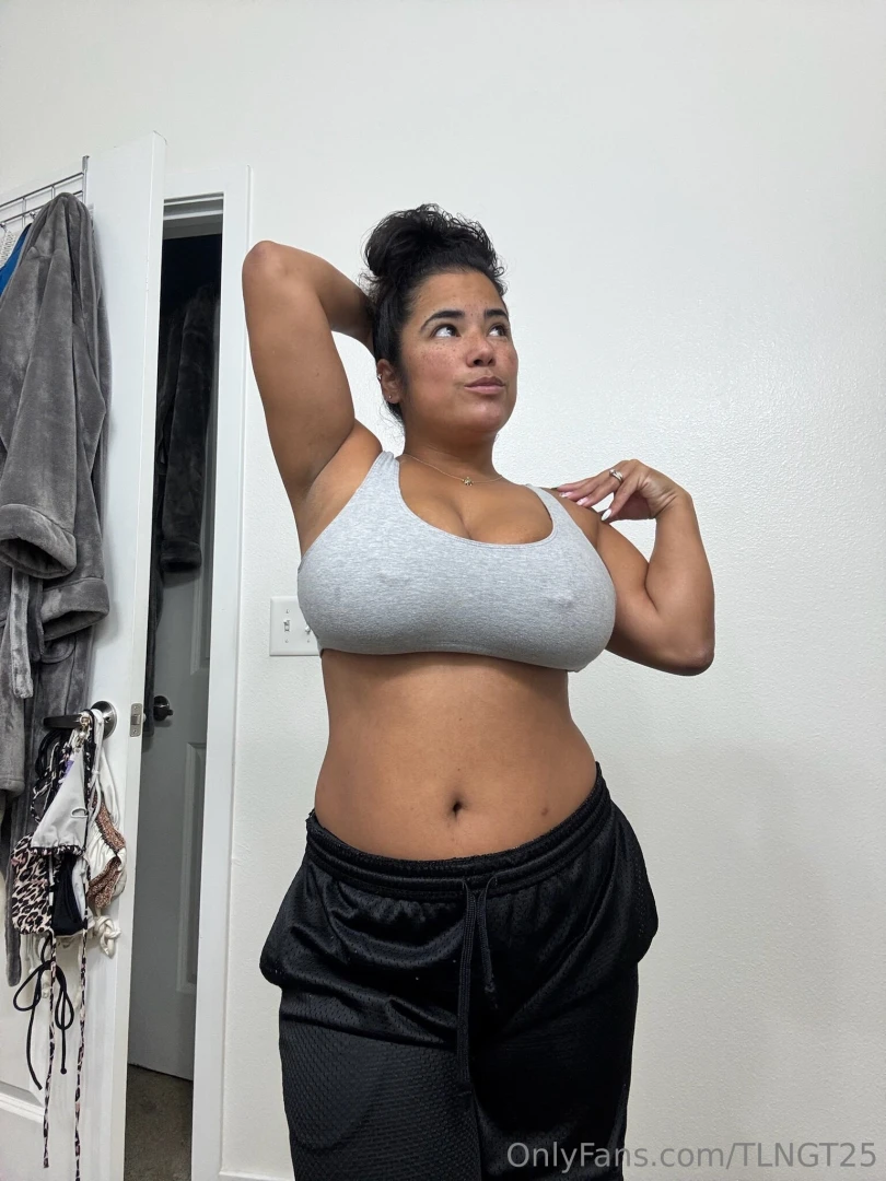 Hair tied up sports bra and gym shorts i m just a regular girl 