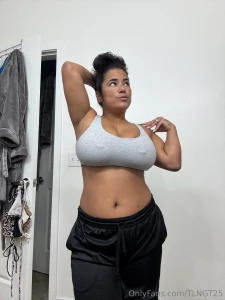 Hair tied up sports bra and gym shorts i m just a regular girl