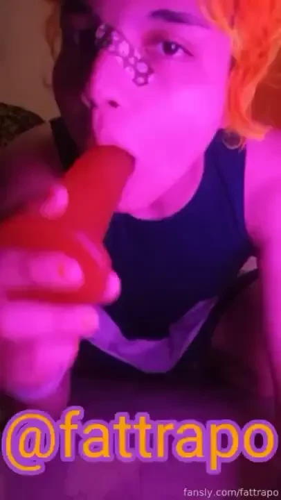 Dildo sucking and inserting under violet light with blue dress 