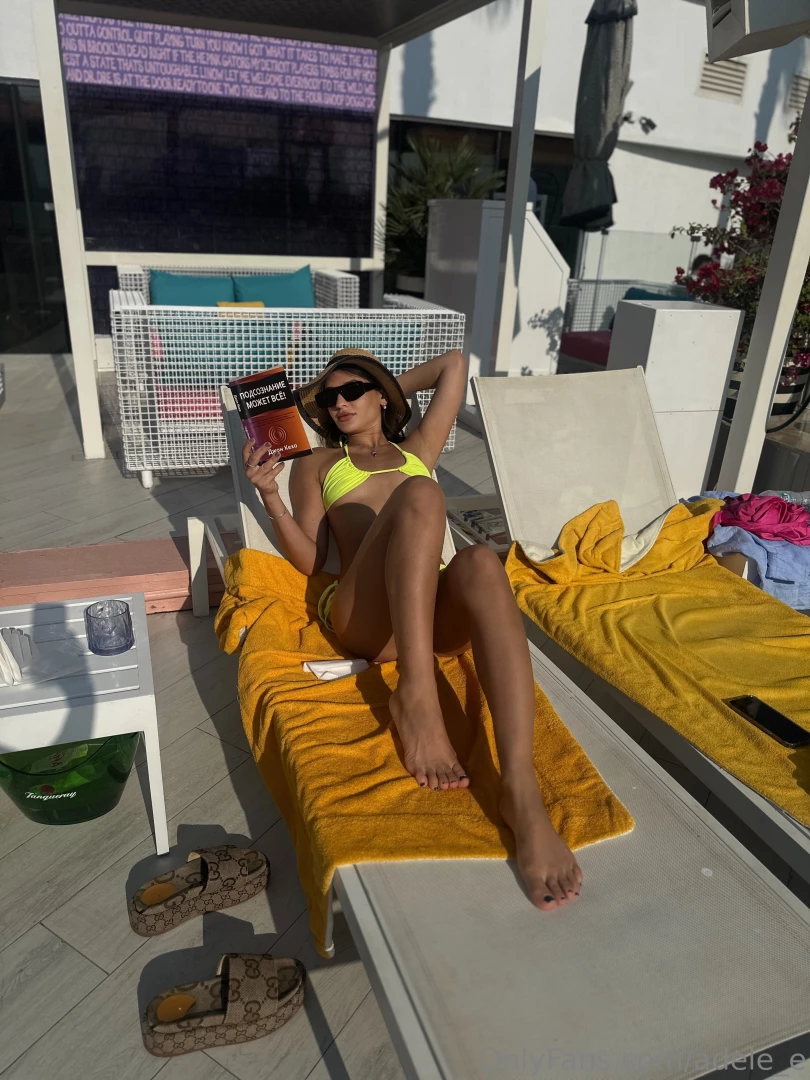 A beach soft sand the sound of the surf and a book that opens the door 