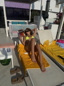 A beach soft sand the sound of the surf and a book that opens the door