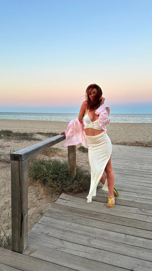 The sea breeze is teasing my dress and maybe a bit of me too sun on my 