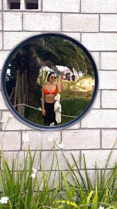 The white flowers around the mirror makes the picture perfect in my