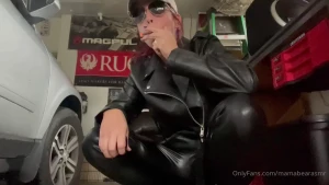 Smoking in leather dominating role-play