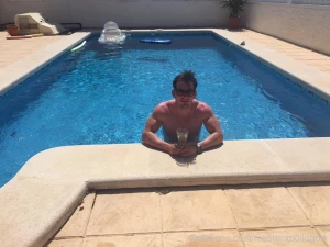 Topping up my tan by the pool pool muscle bicep pic lifestyle