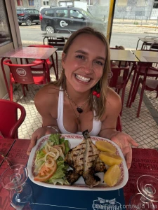 Here i am in portugal wearing nothing but my swimsuit and holding a