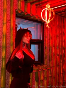 A cup of coffee a light playlist in the background a window with rain