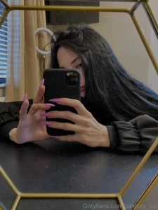 Wrapped in the embrace of midnight i emerge in an ensemble of ebony