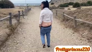 Buttcrack in jeans on public beach