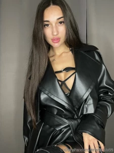 Another photo shoot of a girl in leather lots of straps on the body