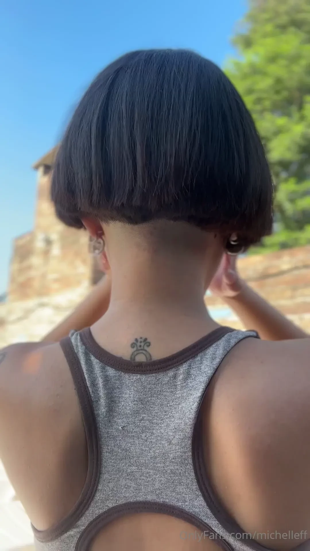 God is a woman with a bob haircut and a zero undercut 