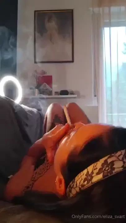 Chainsmoking two marlboro reds while laying on my couch in backside 