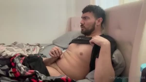 Amateur guy masturbates his big dick while watching porn