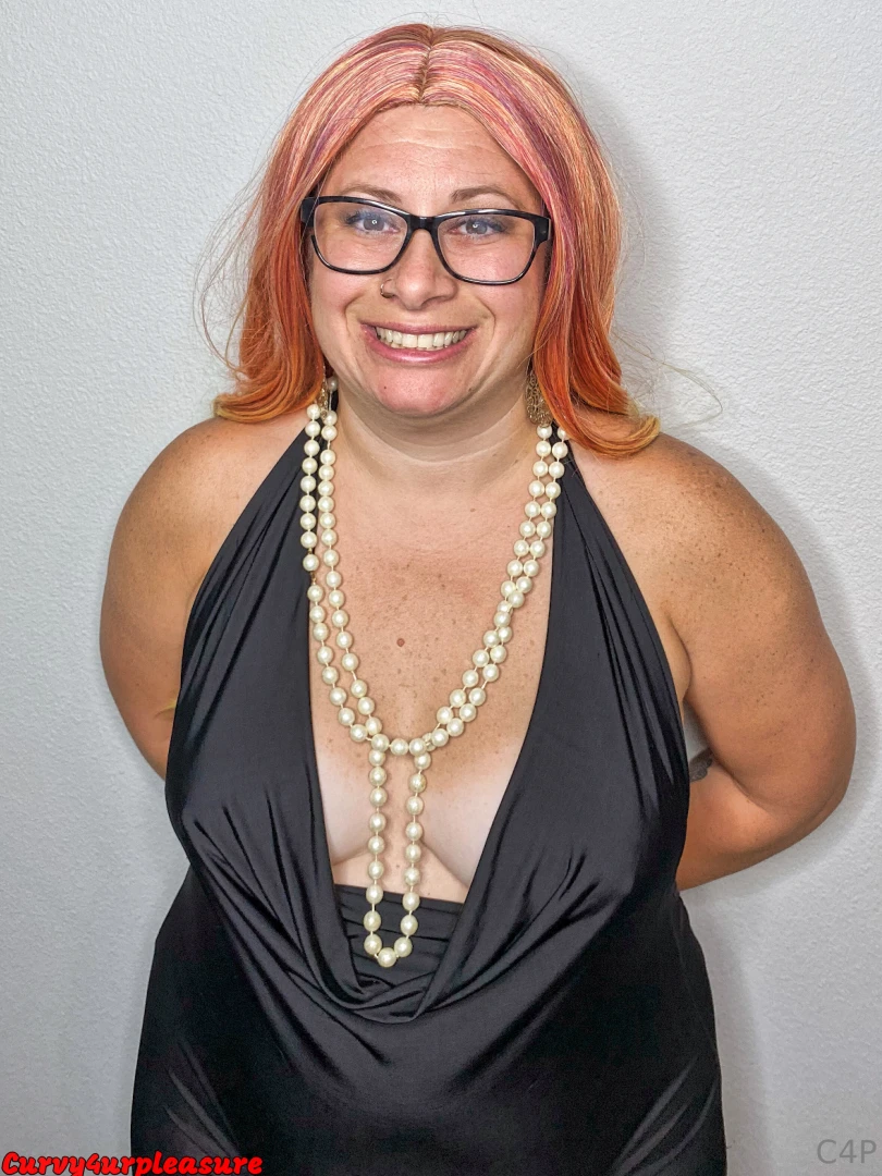 Little black dress pearl necklace and red head photo shoot brings out 