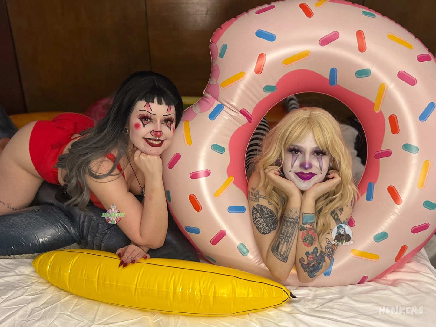 Just a clown reclining in an inflatable donut getting eaten out by her 