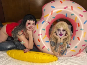 Just a clown reclining in an inflatable donut getting eaten out by her