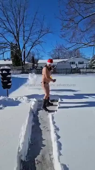 Cleaning up the snow in my new santa bkkini 