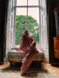 Nbsp nbsp nbsp she was seated comfortably on a sofa by the window