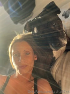 Laying on the bed soaking up abit of sun with the dog