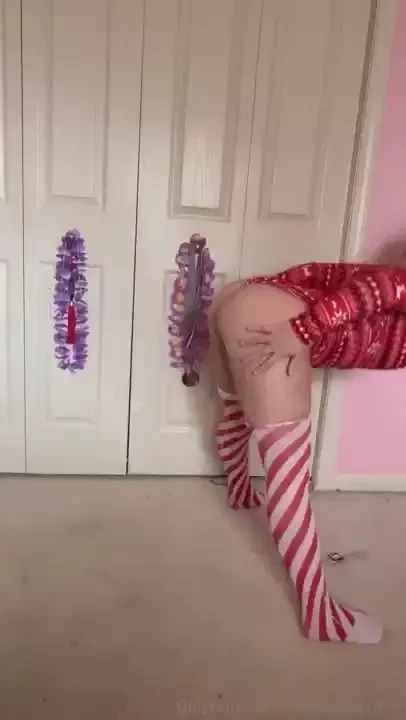 Doing yoga in my christmas romper and then just candy cane socks 