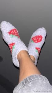 My pretty feet in fuzzyyy strawberry socks