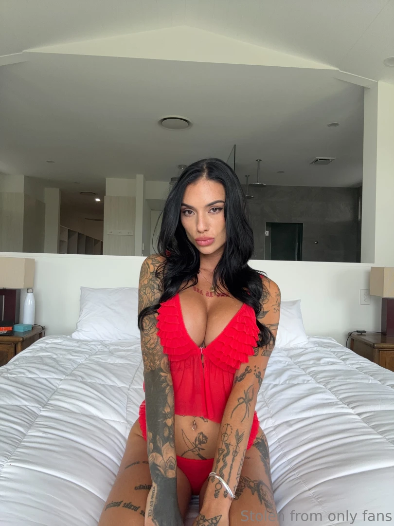 Wrapped in red on the bed and teasing you just right a little squeeze 