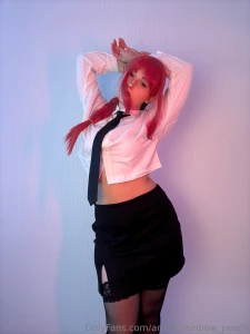 Pink hair a sharp tie and a little bit of sass in every move this look