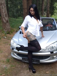 The grass soft beneath my feet as i lean against the car the