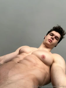 From the ground up abs and chest flexed teasing just enough to hint at